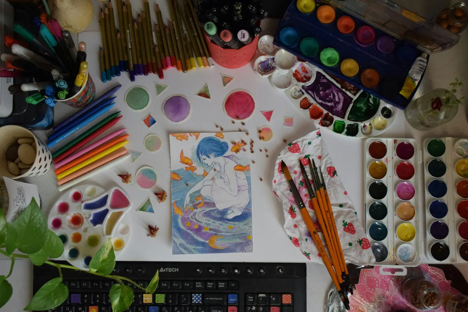 Flat lay of art supplies used as props in a graduation photo shoot